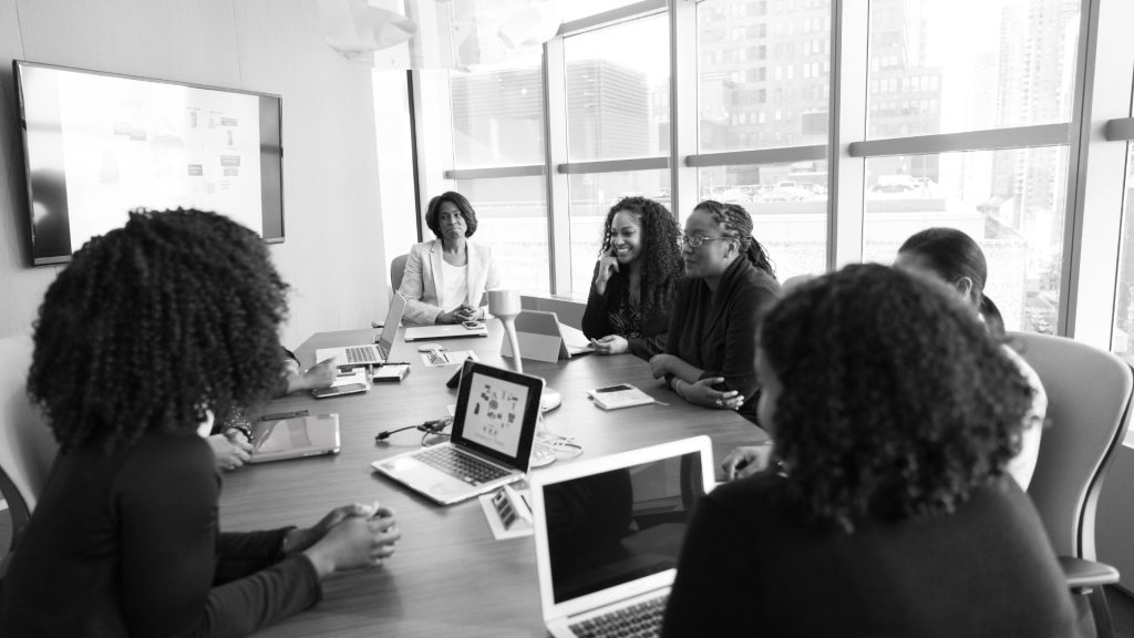 diverse women around the board table
