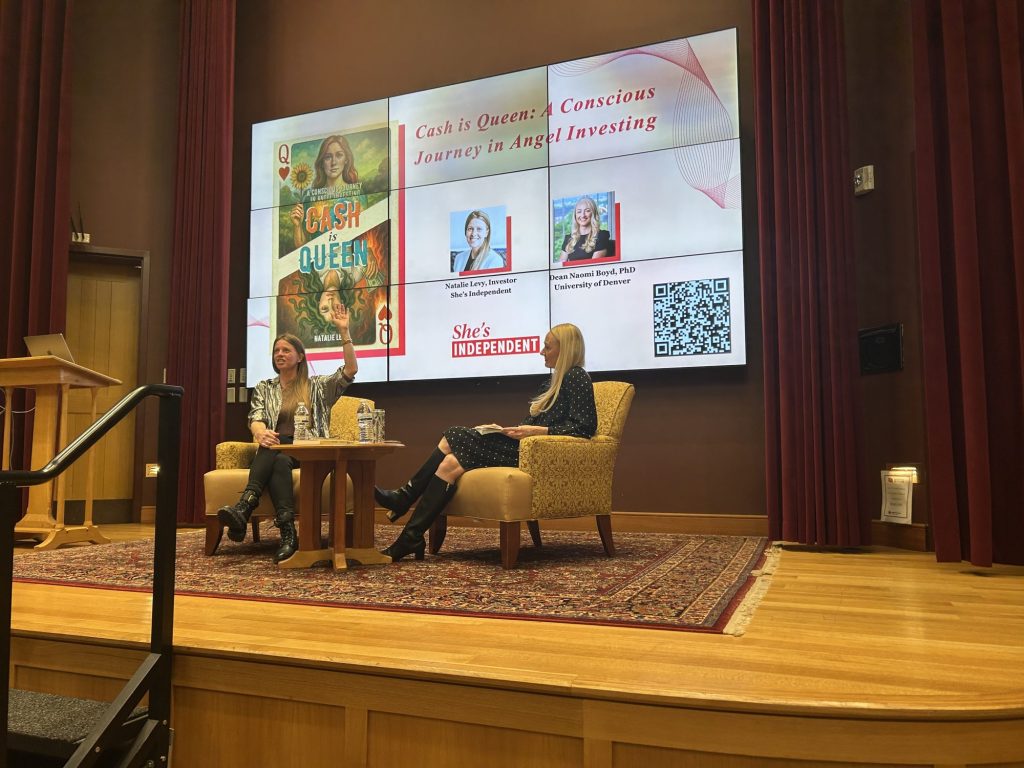 Natalie Levy on stage with Dean Naomi Boyd at the Cash is Queen launch at the University of Denver